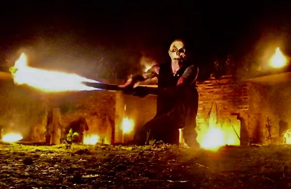 Fire staff performance, close-up action shot